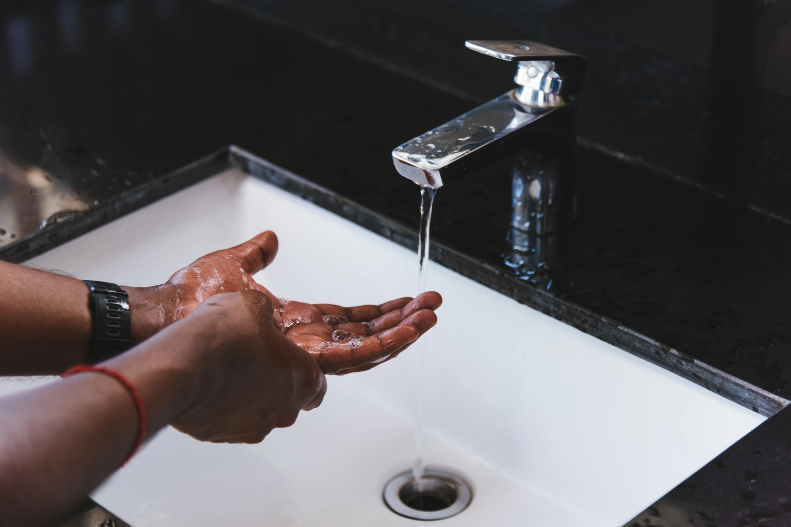 OCD Treatment: A person scrubbing their hands at a sink